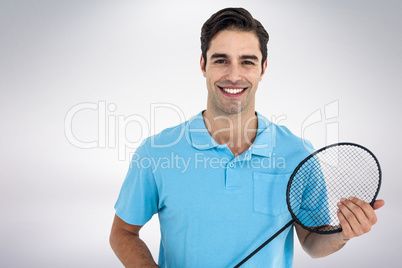 Composite image of badminton player holding badminton racket