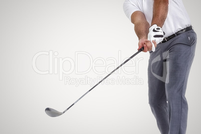 Composite image of golf player taking a shot