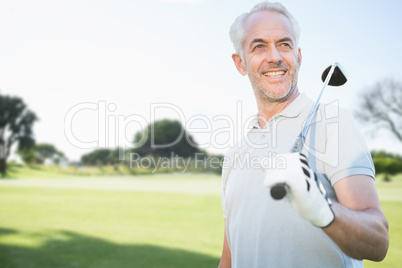 Composite image of man holding a golf club