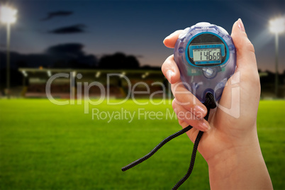 Close up of a hand holding a timer