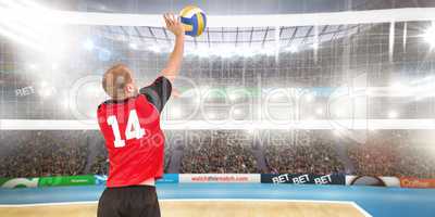 Composite image of rear view of sportsman hitting volleyball