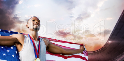 Composite image of portrait of happy sportsman posing with an am