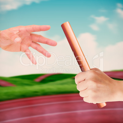 Composite image of businessman holding hand out