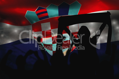 Composite image of silhouettes of football supporters