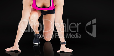 Composite image of female athlete on the start line