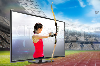 Composite image of side view of woman practicing archery