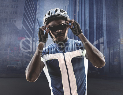 Composite image of cyclist is posing