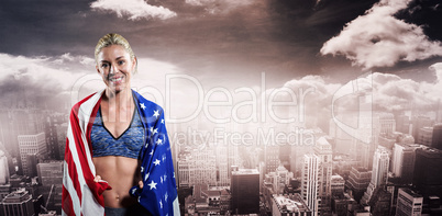 Athlete with american flag wrapped around her body