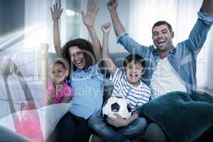 Composite image of family watching sport match on television and