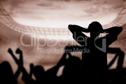 Composite image of silhouettes of football supporters Composite image of silhouettes of football supporters