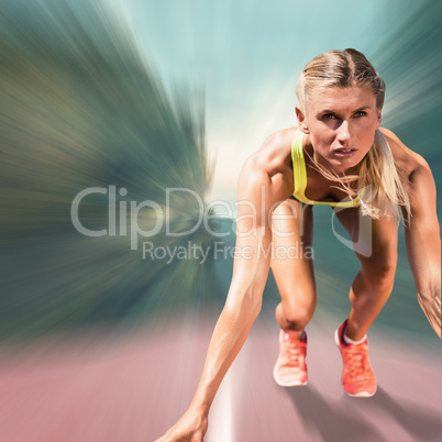 Composite image of sportswoman starting to sprint