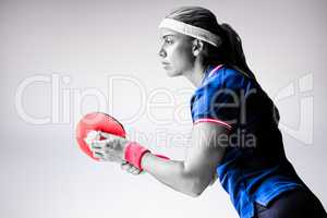 Composite image of female athlete playing ping pong