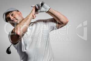 Composite image of portrait of golf player taking a shot