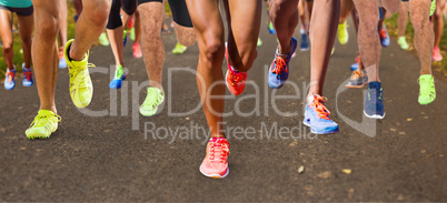 Composite image of close up of sportsman legs running