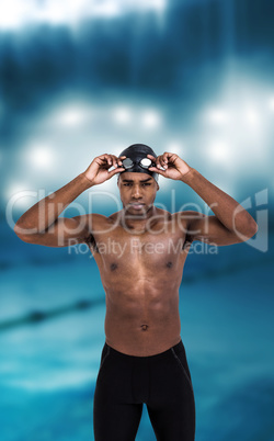 Composite image of swimmer holding goggles