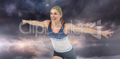 Composite image of female athlete posing after victory