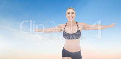 Female athlete raising arms