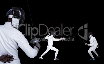 Composite image of man wearing fencing suit practicing with swor