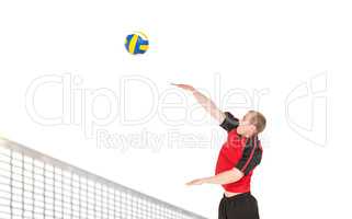 Sportsman hitting volleyball