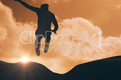 Composite image of sportsman jumping on a white background