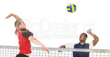 Composite image of sportsman hitting volleyball