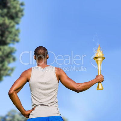 Composite image of rear view of sportsman holding a cup