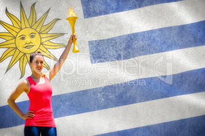 Composite image of sporty woman posing and smiling with olympic