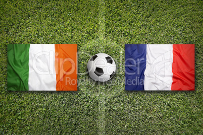 Ireland vs. France flags on soccer field