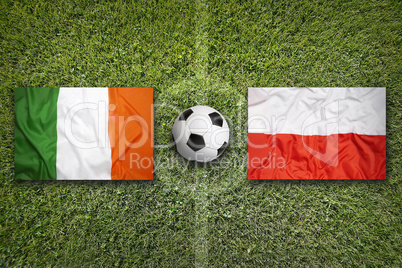 Ireland vs. Poland flags on soccer field