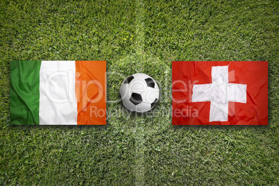Ireland vs. Switzerland flags on soccer field