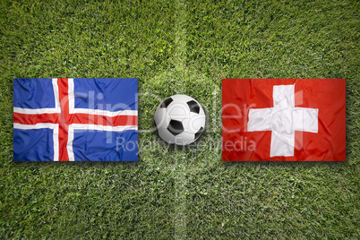 Iceland vs. Switzerland flags on soccer field