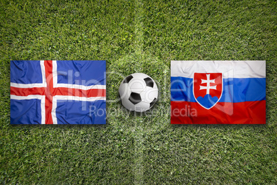 Iceland vs. Slovakia flags on soccer field