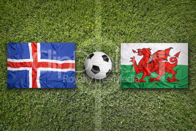 Iceland vs. Wales flags on soccer field