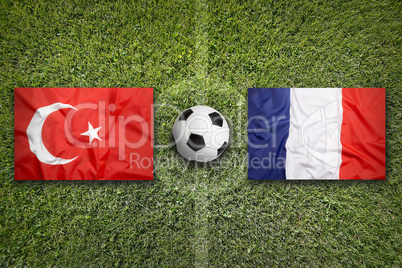 Turkey vs. France flags on soccer field