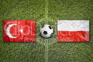Turkey vs. Poland flags on soccer field