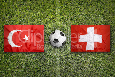 Turkey vs. Switzerland flags on soccer field