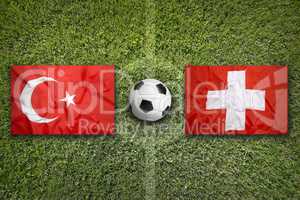 Turkey vs. Switzerland flags on soccer field