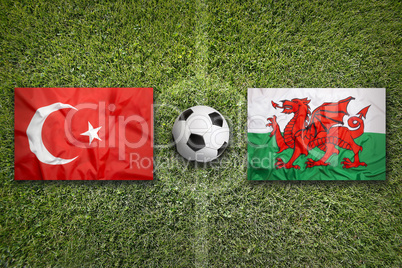 Turkey vs. Wales flags on soccer field