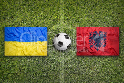 Ukraine vs. Albania flags on soccer field