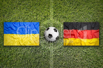 Ukraine vs. Germany flags on soccer field