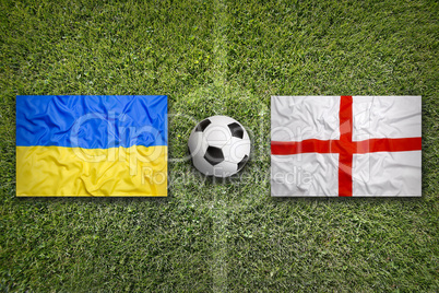 Ukraine vs. England flags on soccer field