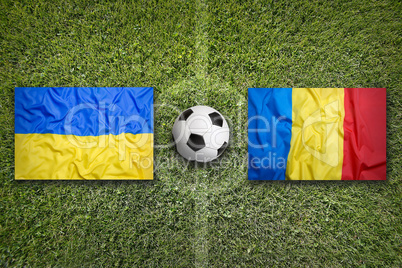 Ukraine vs. Romania flags on soccer field