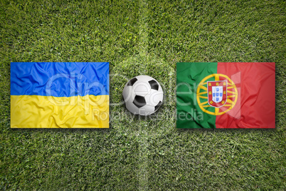 Ukraine vs. Portugal flags on soccer field