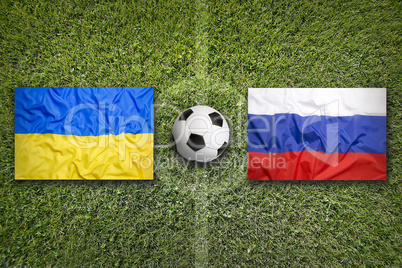Ukraine vs. Russia flags on soccer field
