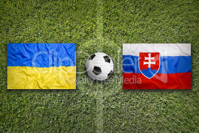 Ukraine vs. Slovakia flags on soccer field