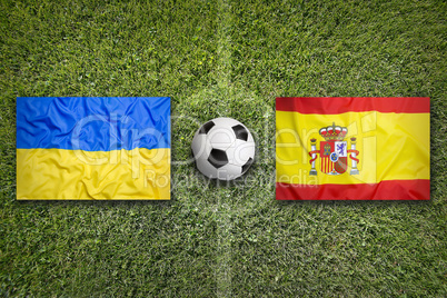 Ukraine vs. Spain flags on soccer field