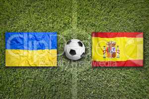 Ukraine vs. Spain flags on soccer field