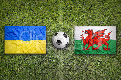 Ukraine vs. Wales flags on soccer field