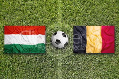 Hungary vs. Belgium flags on soccer field