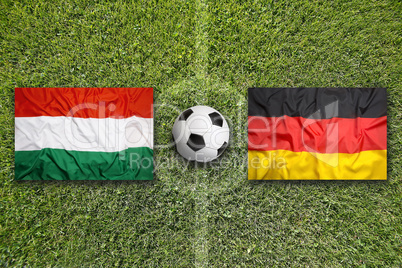 Hungary vs. Germany flags on soccer field